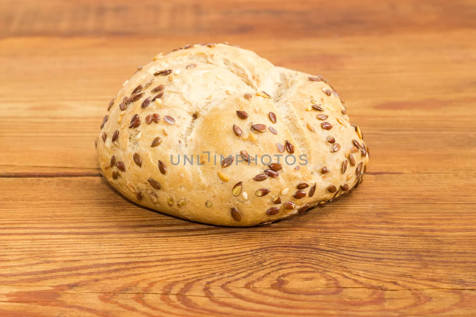 Wheat sourdough bun sprinkled with flax and sesame seeds by anmbph