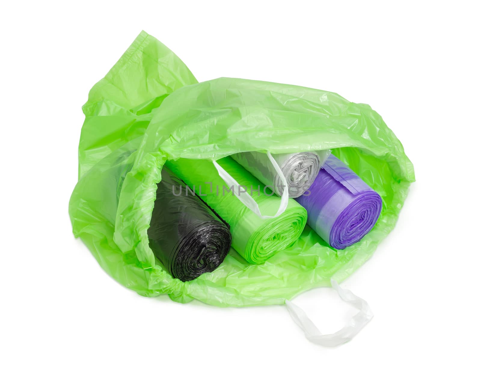 Different garbage bags in rolls in open green garbage bag by anmbph