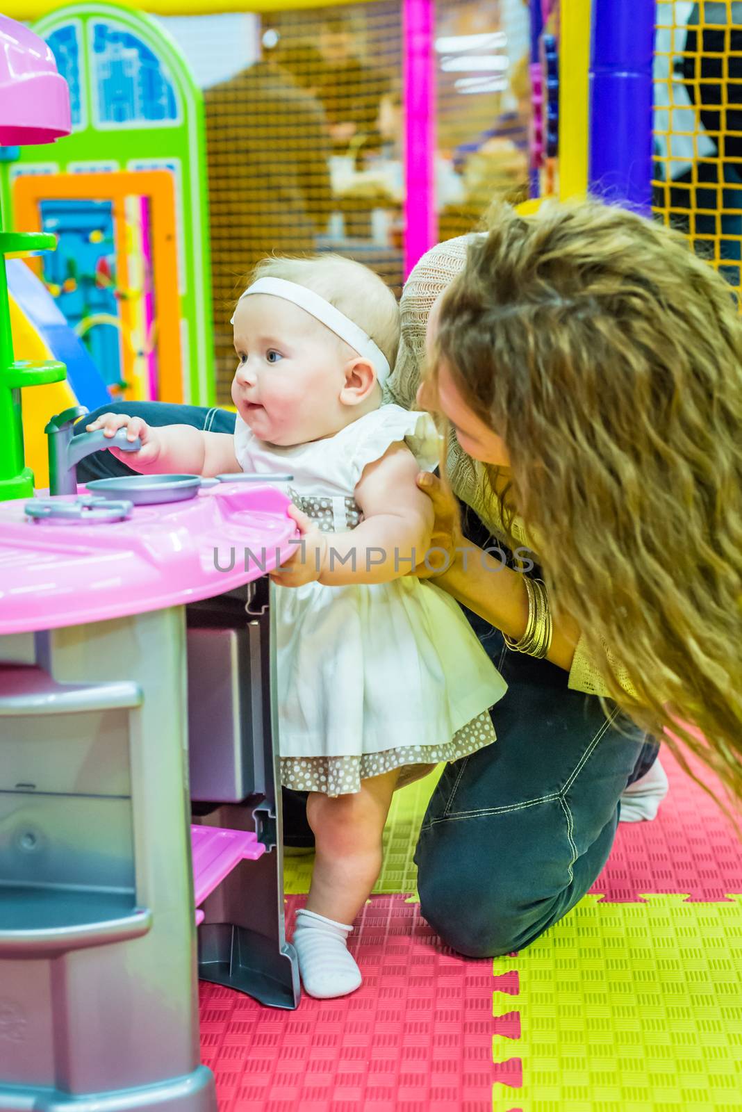 mother and child play in the children's room