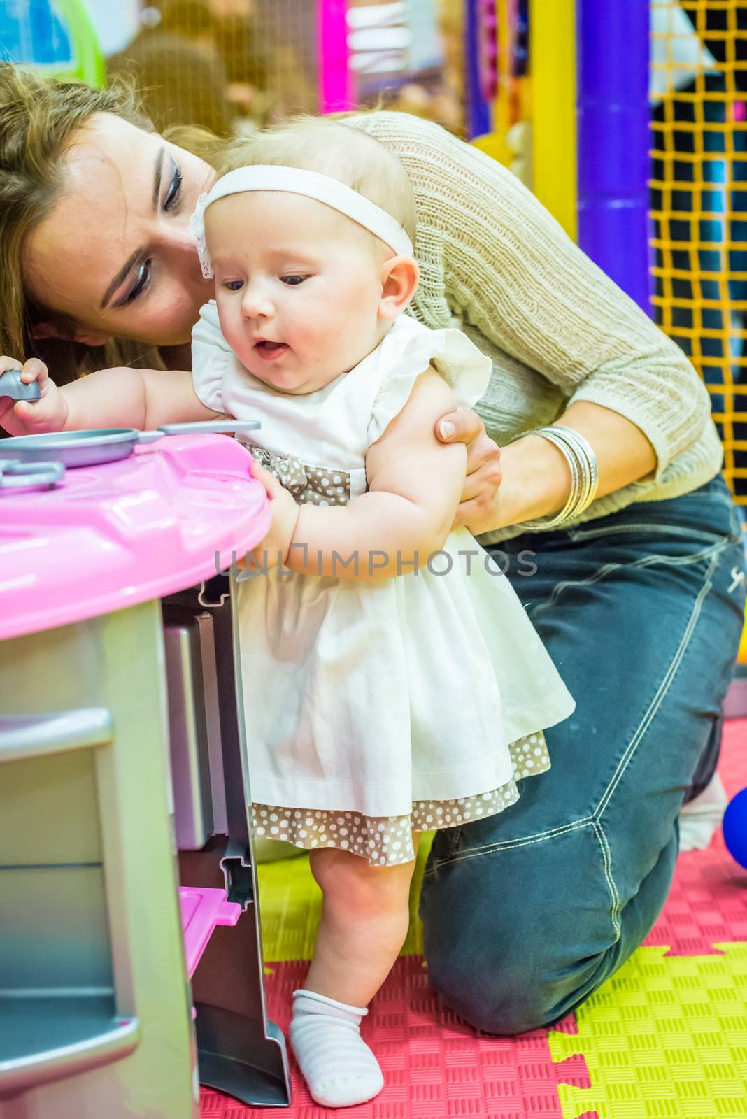 mother and child play in the children's room