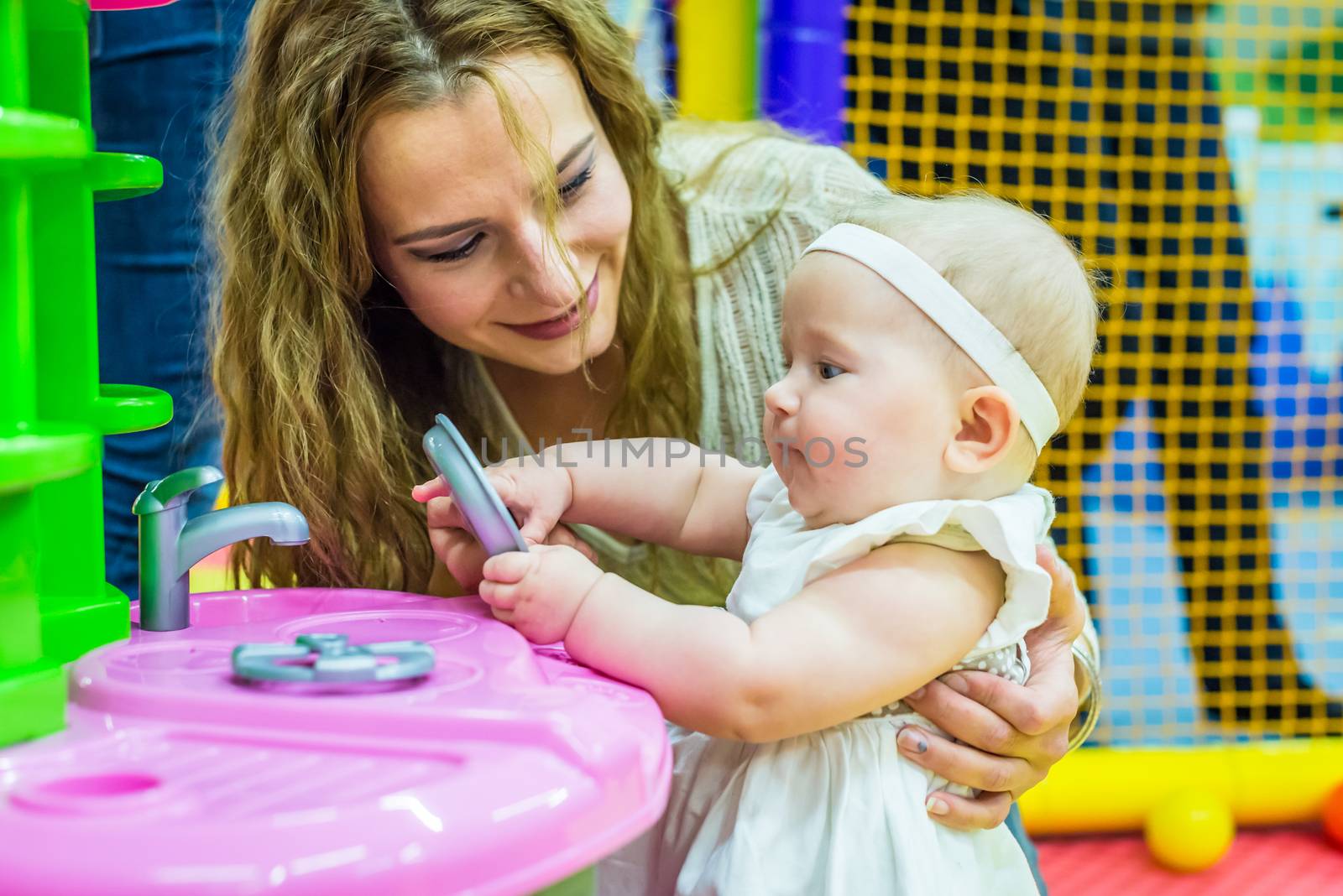 mother and child play in the children's room