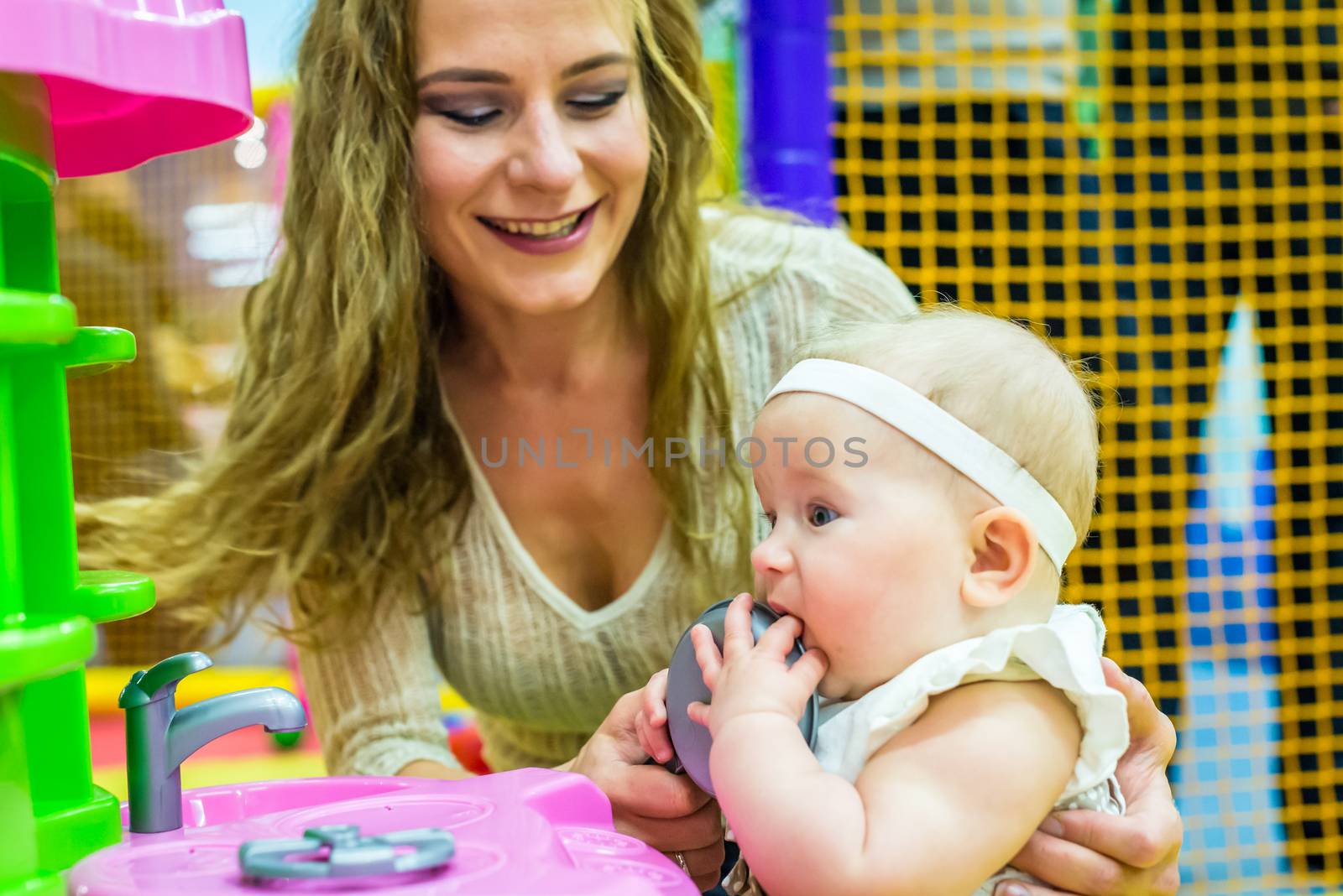 mother and child play in the children's room