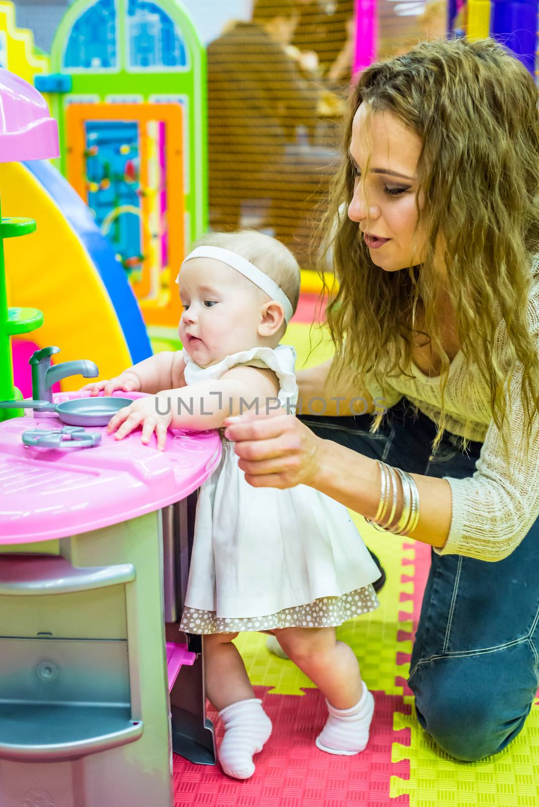 mother and child play in the children's room