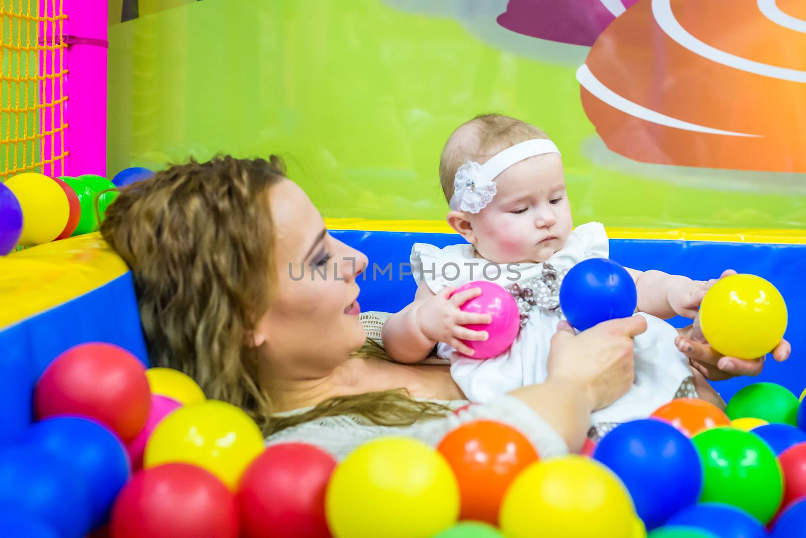 mother and child play in the children's room