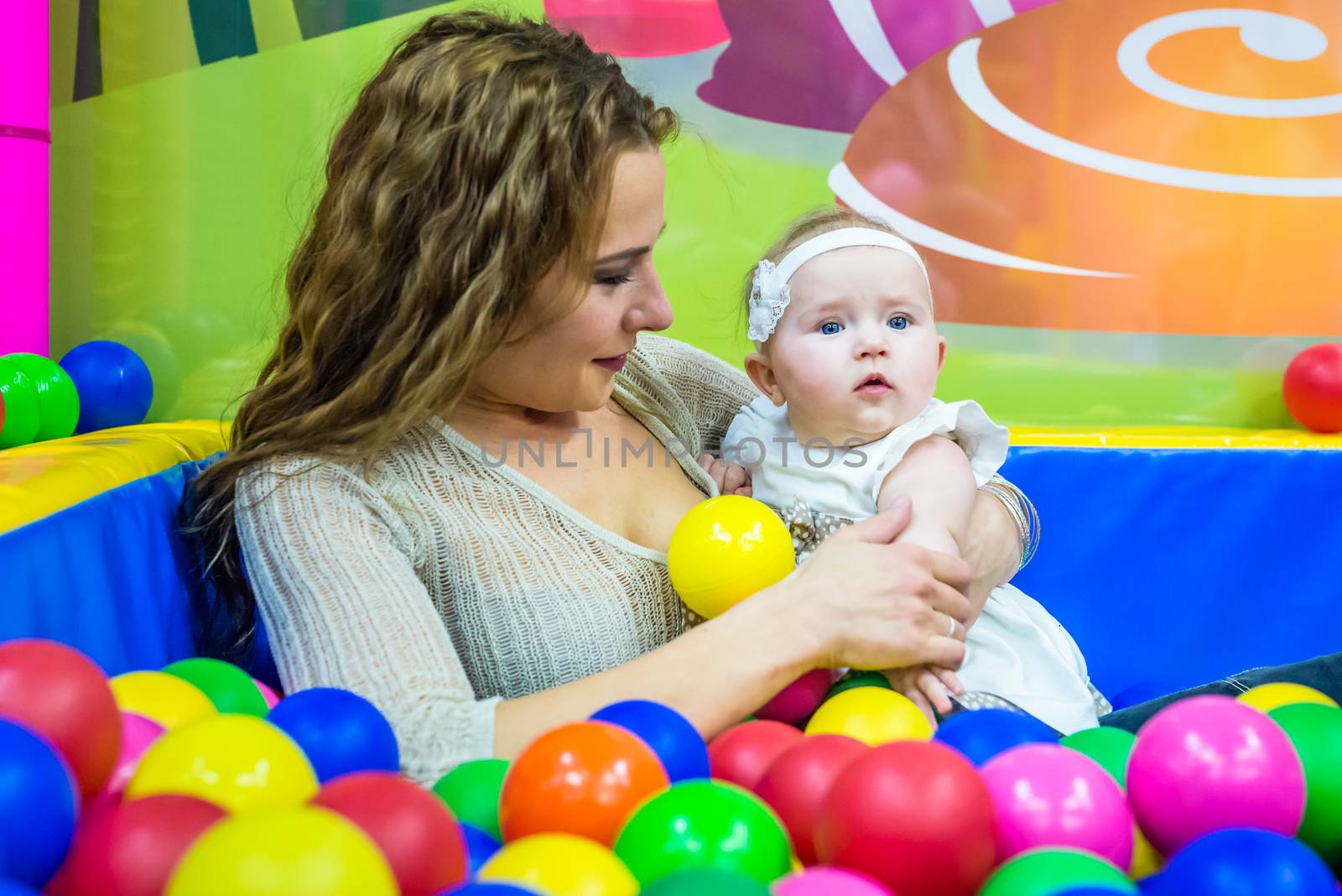 mother and child play in the children's room