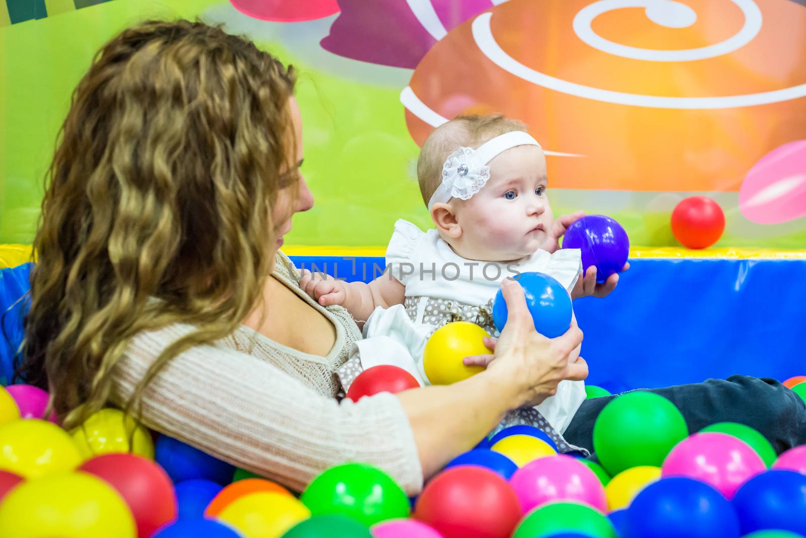 mother and child play in the children's room