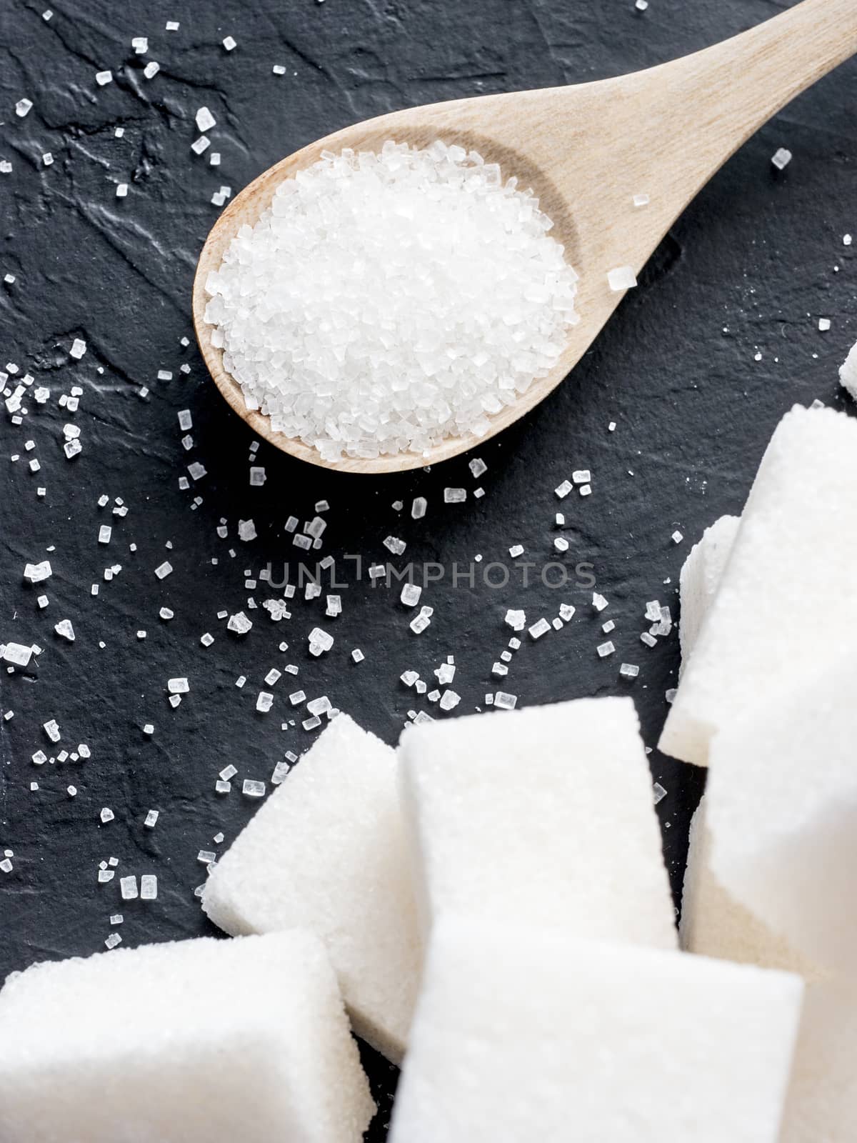 background of white sugar on black by fascinadora