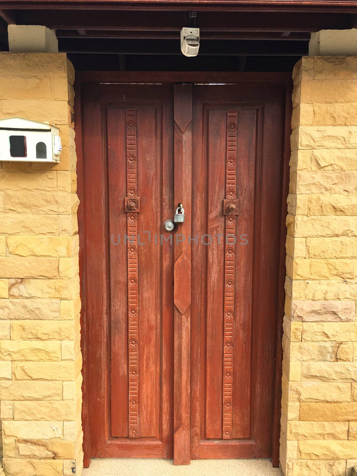 Old wooden entrance doorway. Handmade door with lock.
