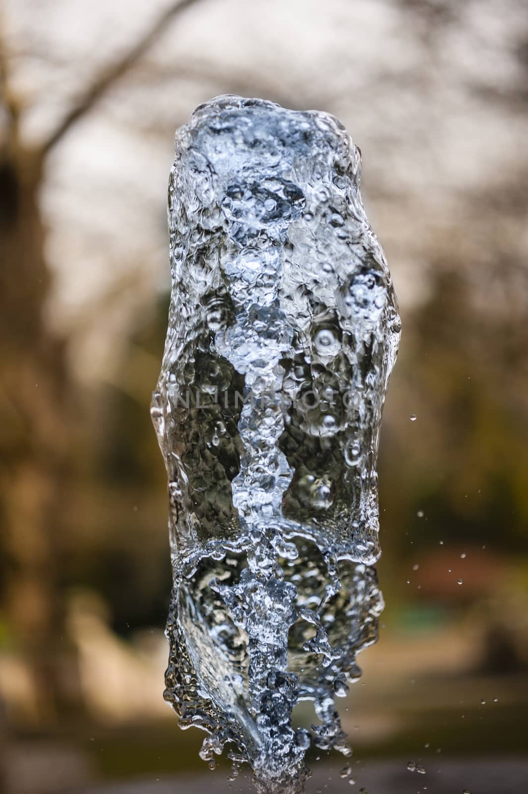 Close up of ornamental fountain water gush.