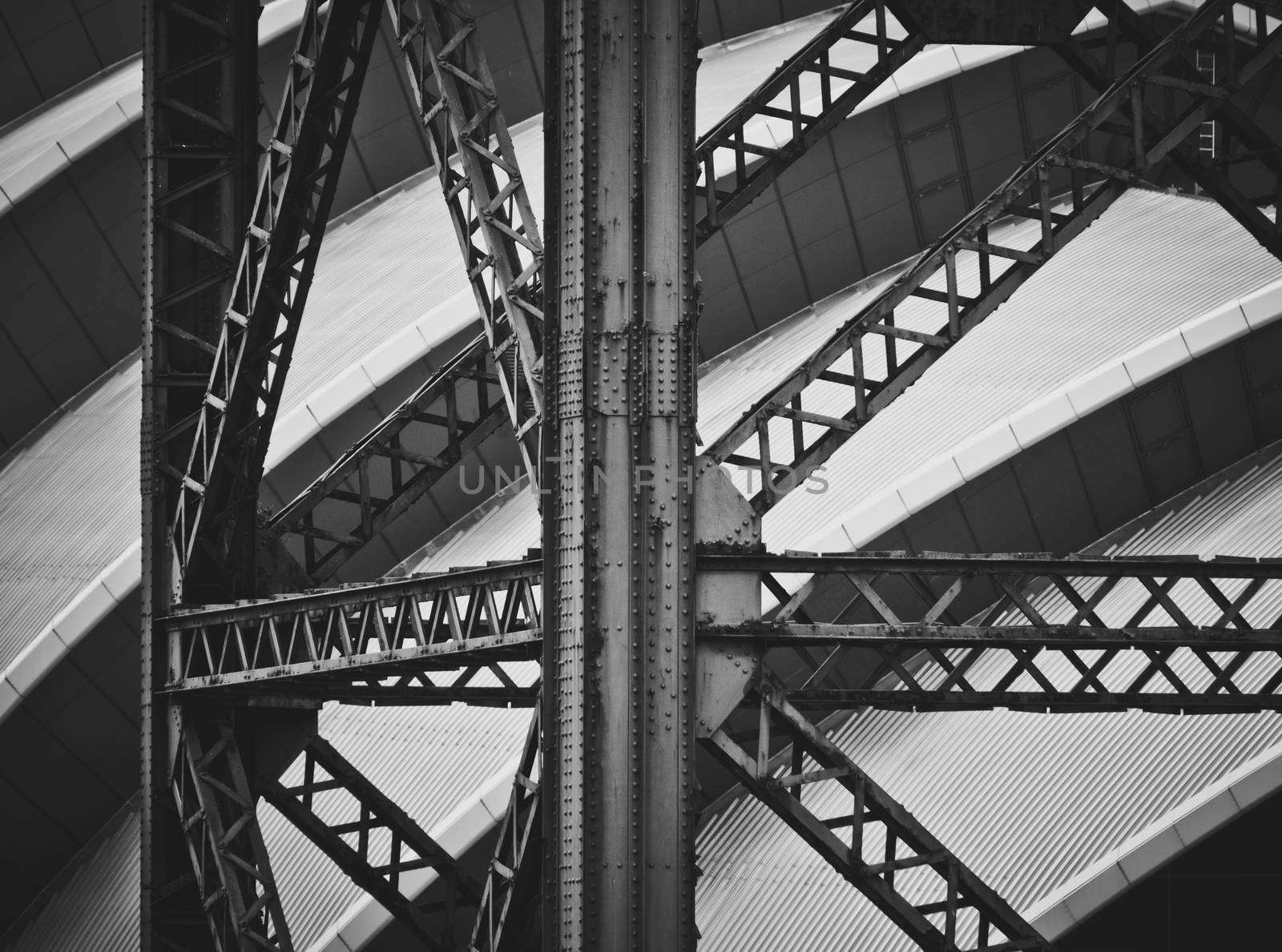 Conceptual Image Of An Old Industrial Crane Against Modern Contemporary Architecture In Glasgow Docklands