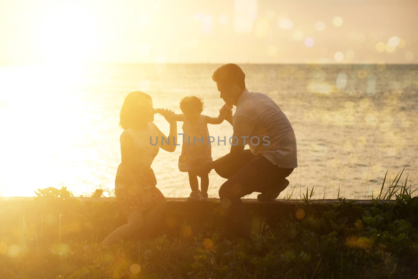 Family outdoor fun in sunset at beach by szefei