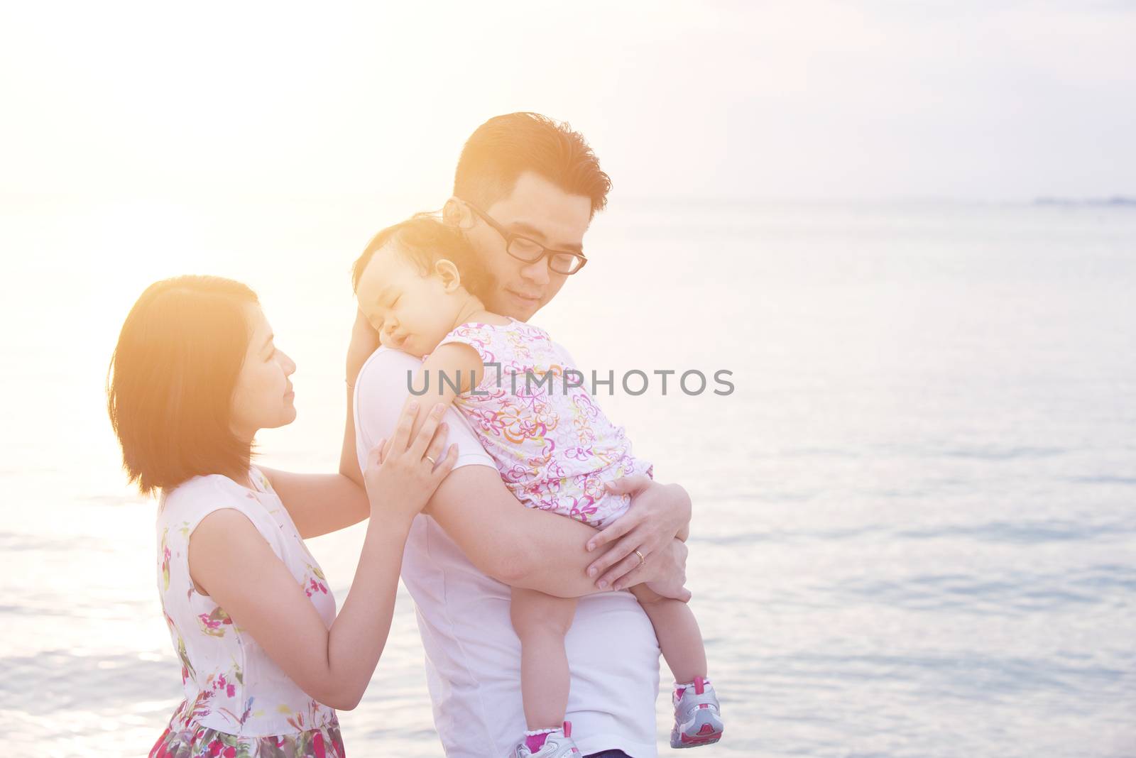 Family enjoying summer holiday at coastline by szefei