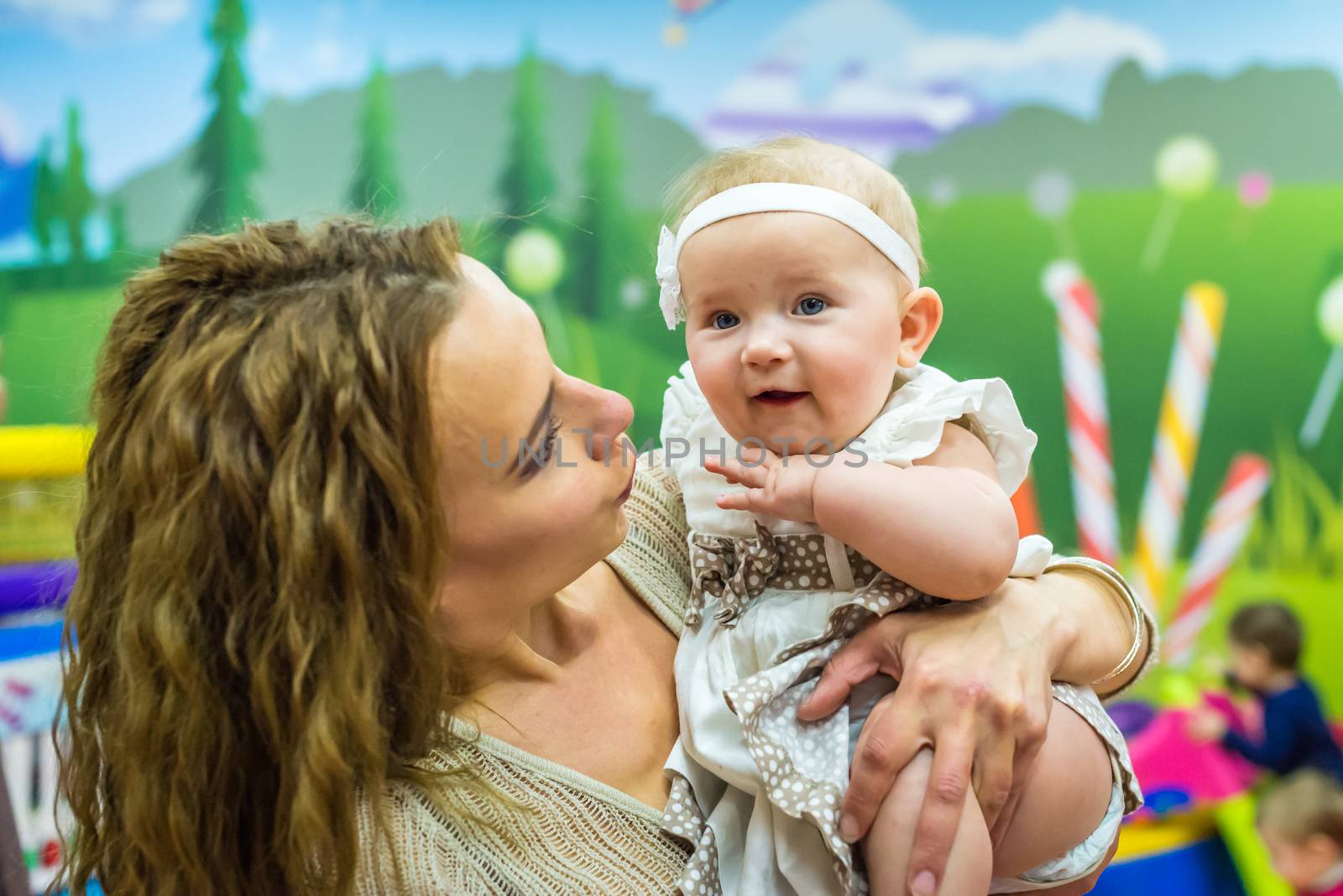 mother and child play in the children's room