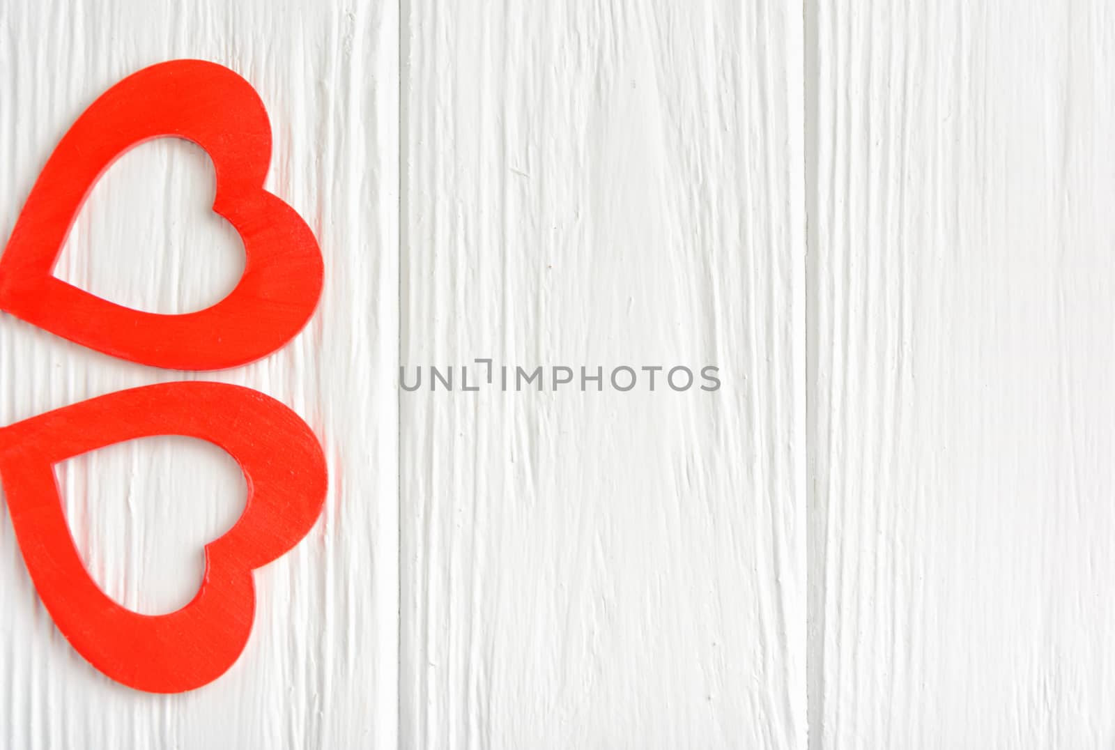White background with two red hearts for a congratulation Happy Valentine's Day. Top view