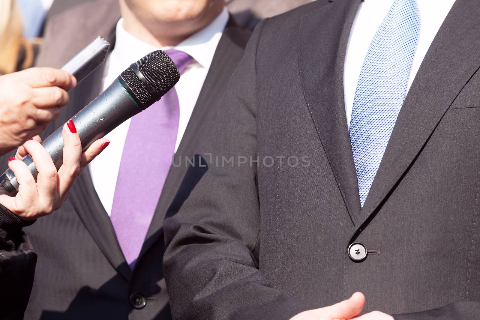 Media interview with businessman or politician by wellphoto