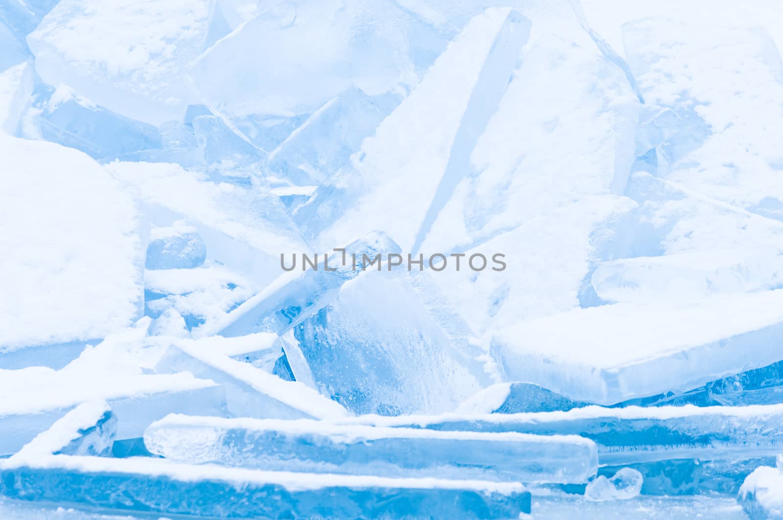 Winter scene at a frozen lake with ice-pack and other ice formations