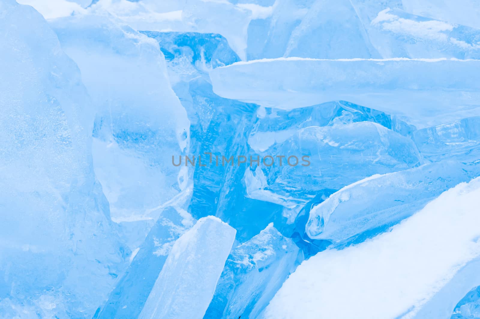 Winter scene at a frozen lake with ice-pack and other ice formations