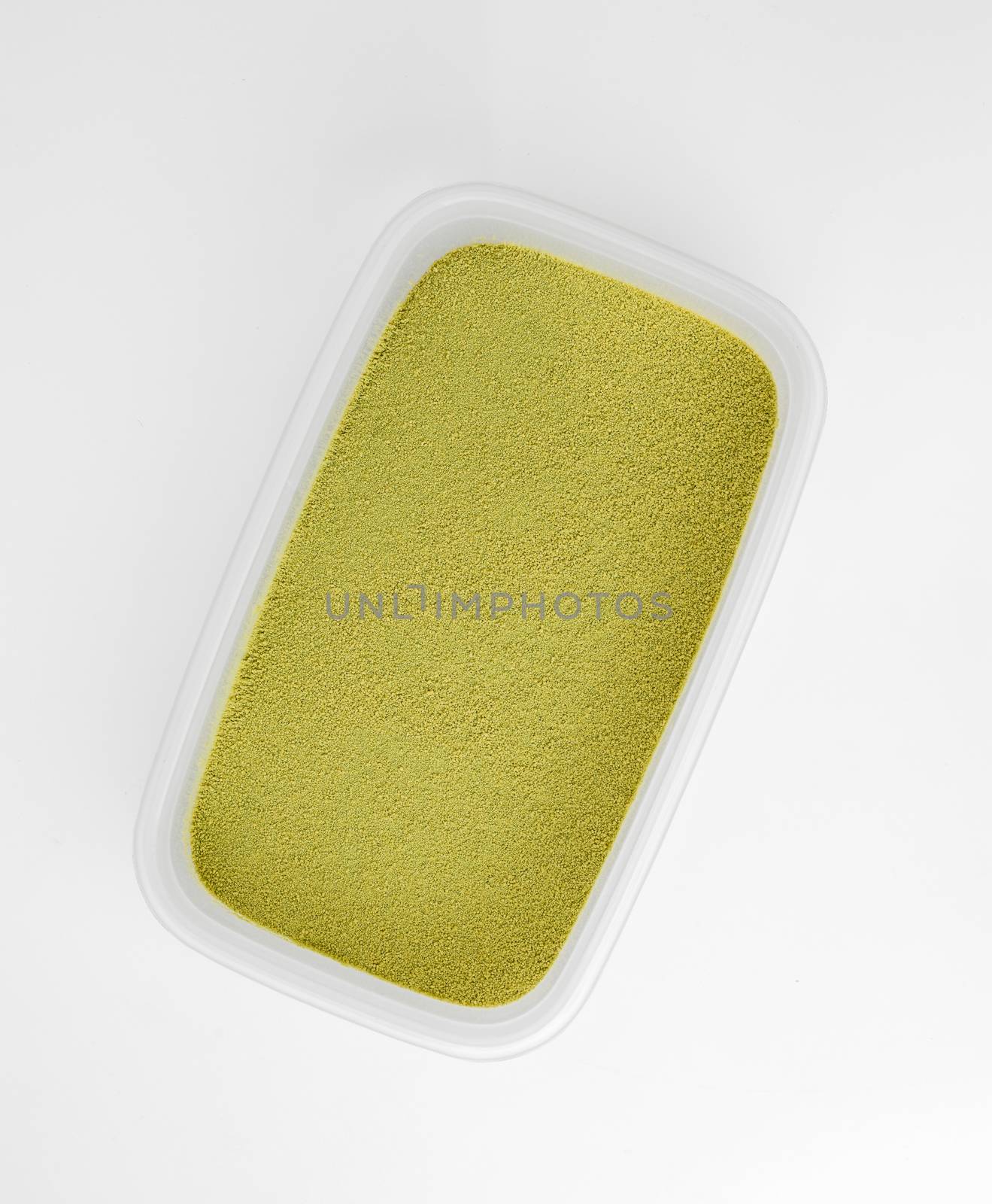 green tea powder in a box isolated on white
