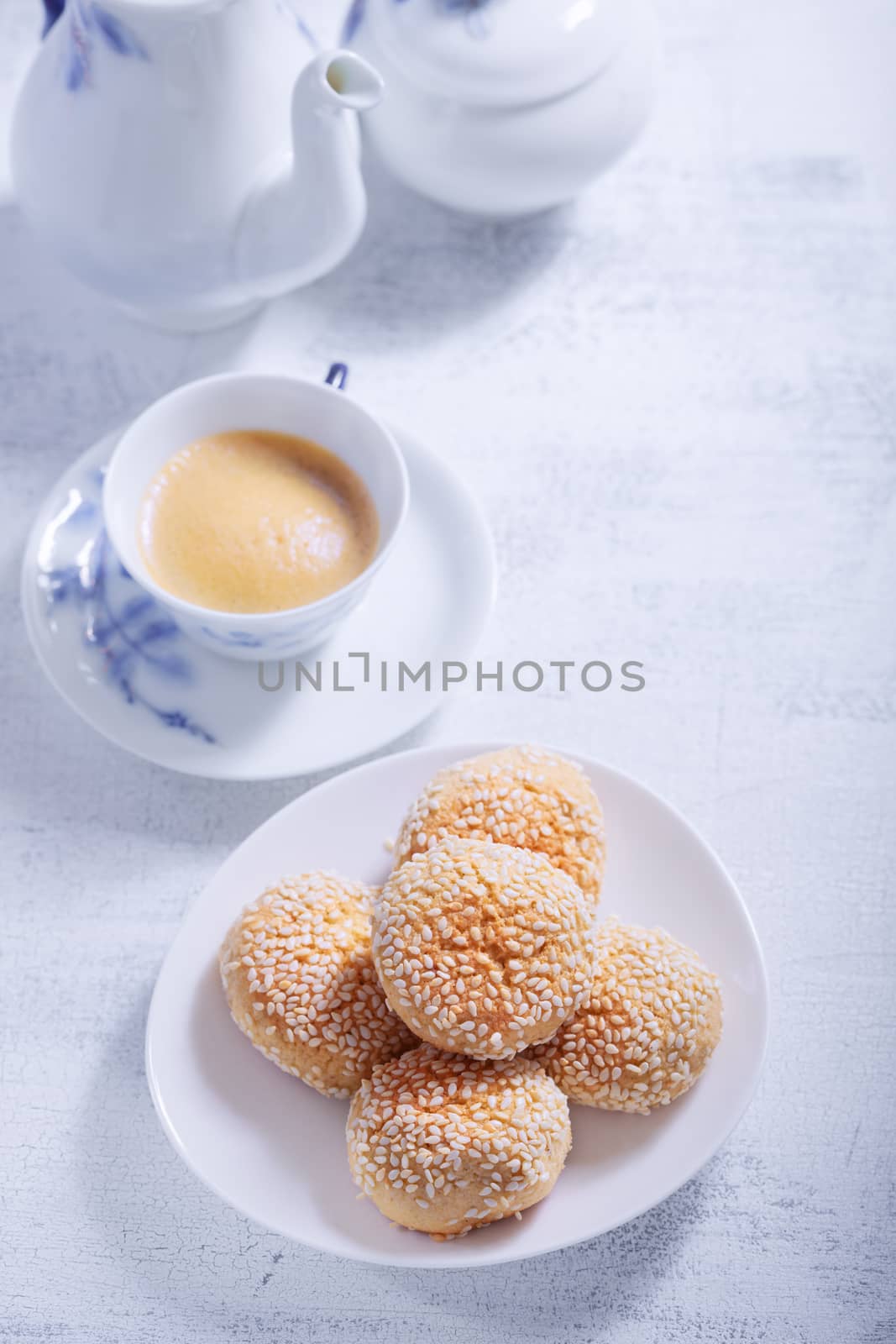 Almonds cookies with coffee served on a table