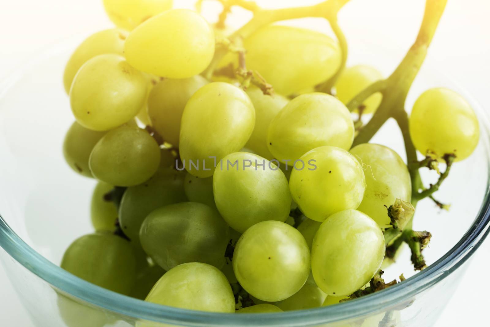 bunch of grapes in a glass bowl. white grape in a glass bowl