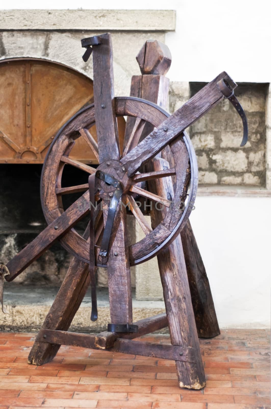 wheel of torture in an old castle used to the times of the Inquisition