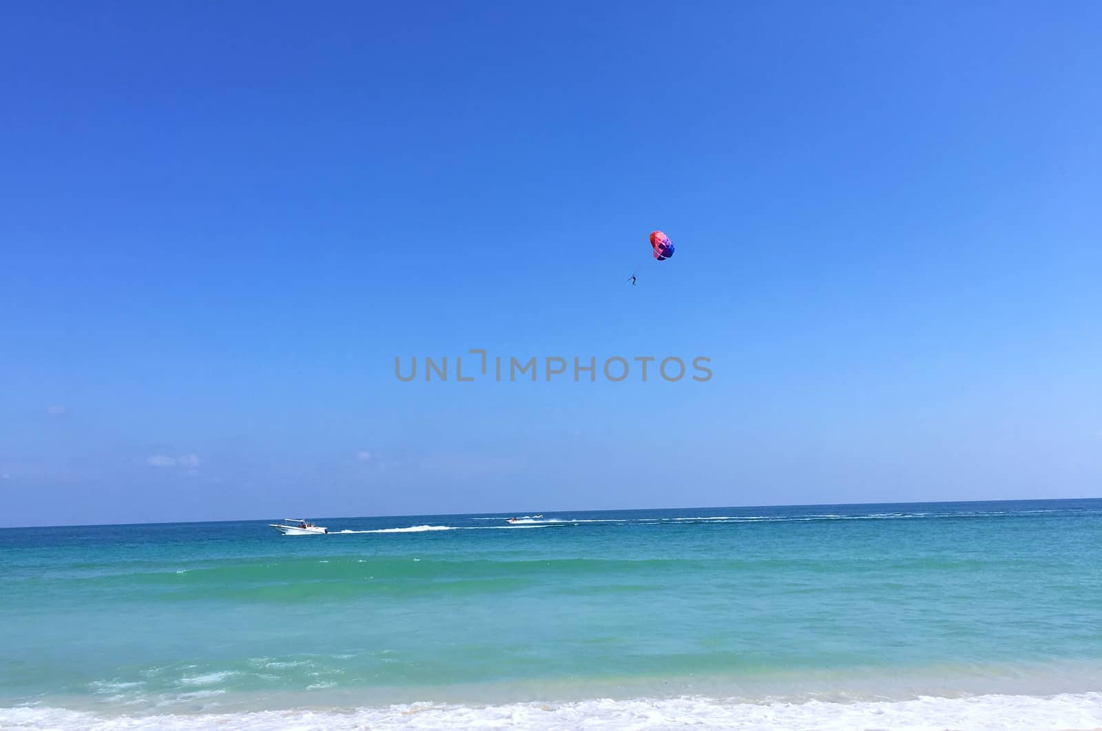 Parasailing and blue sky. Summer vacation and travel adventure concept.