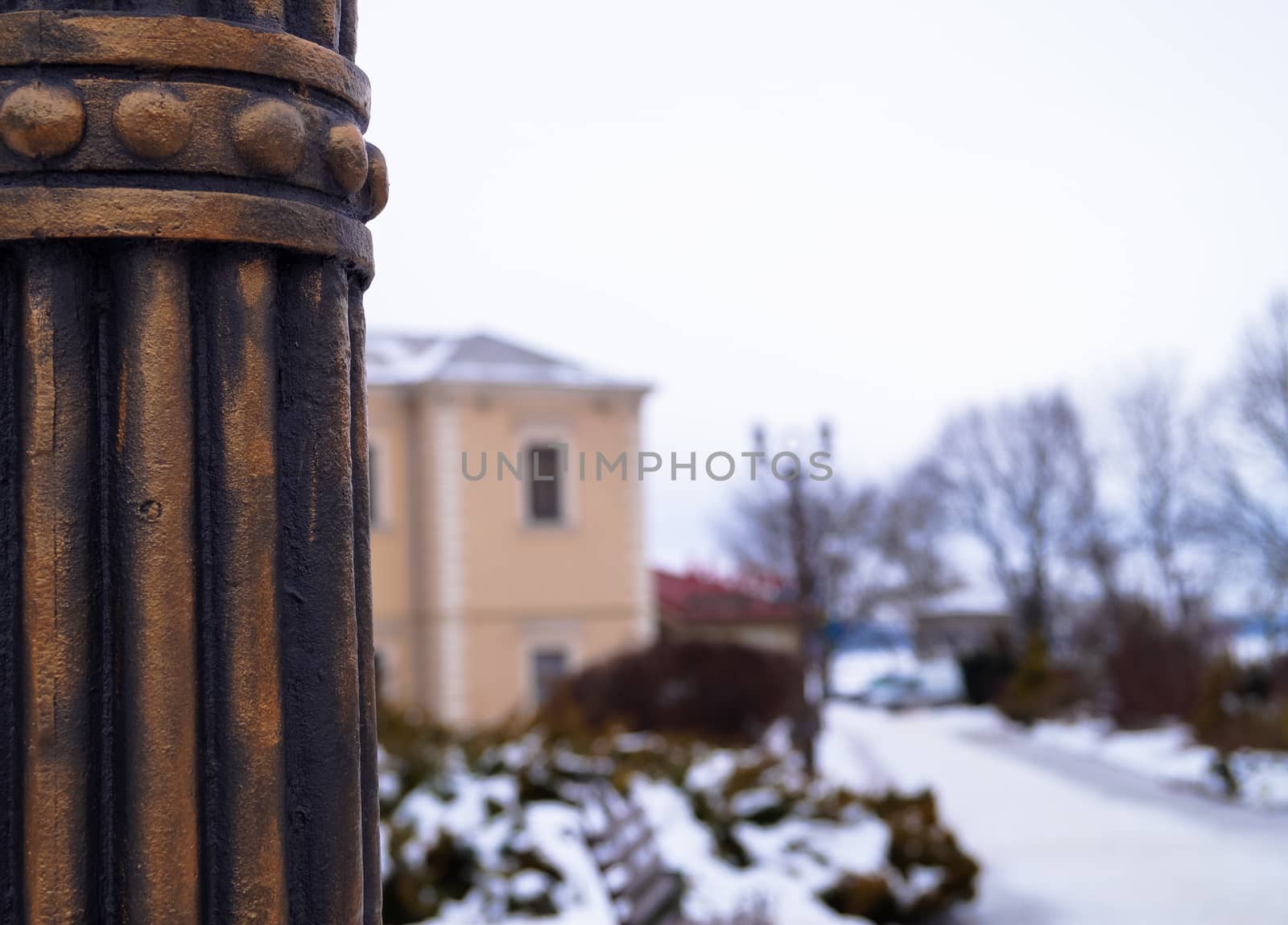 Details of the urban landscape metal pole against street square