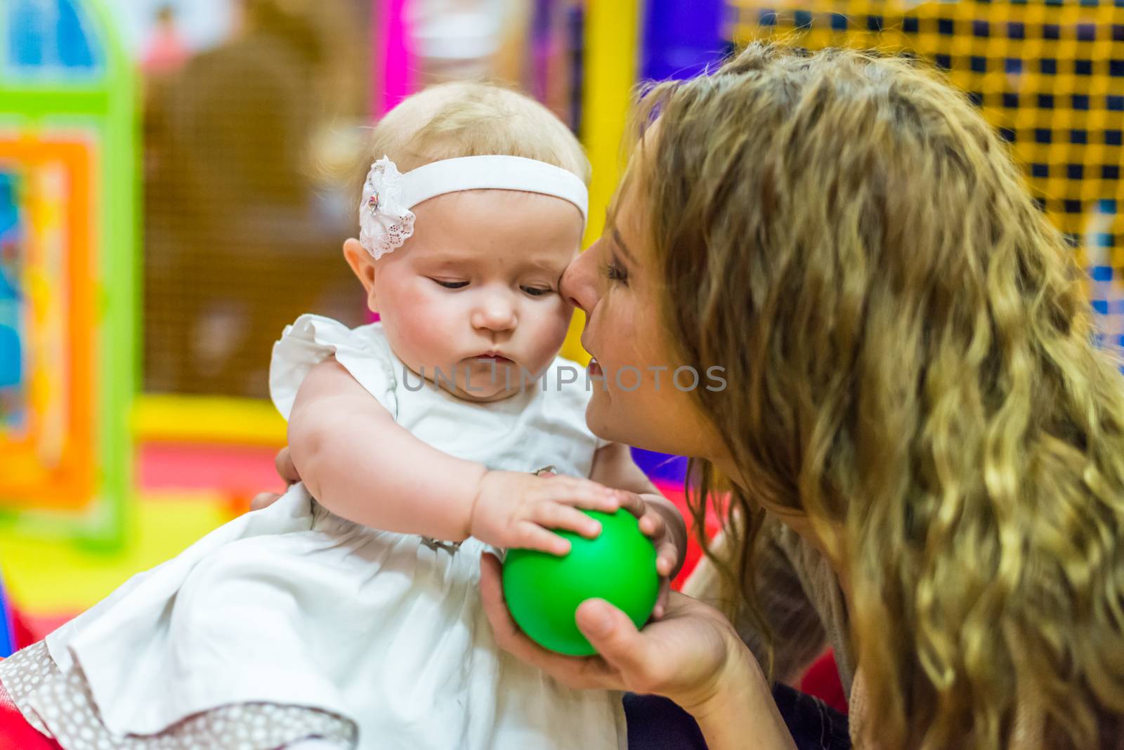 mother and child play in the children's room