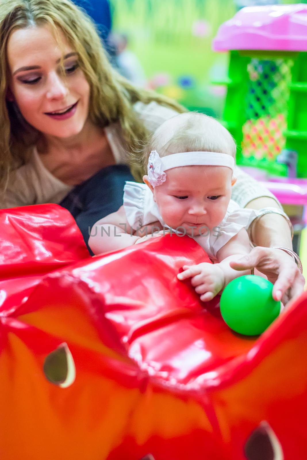 mother and child play in the children's room