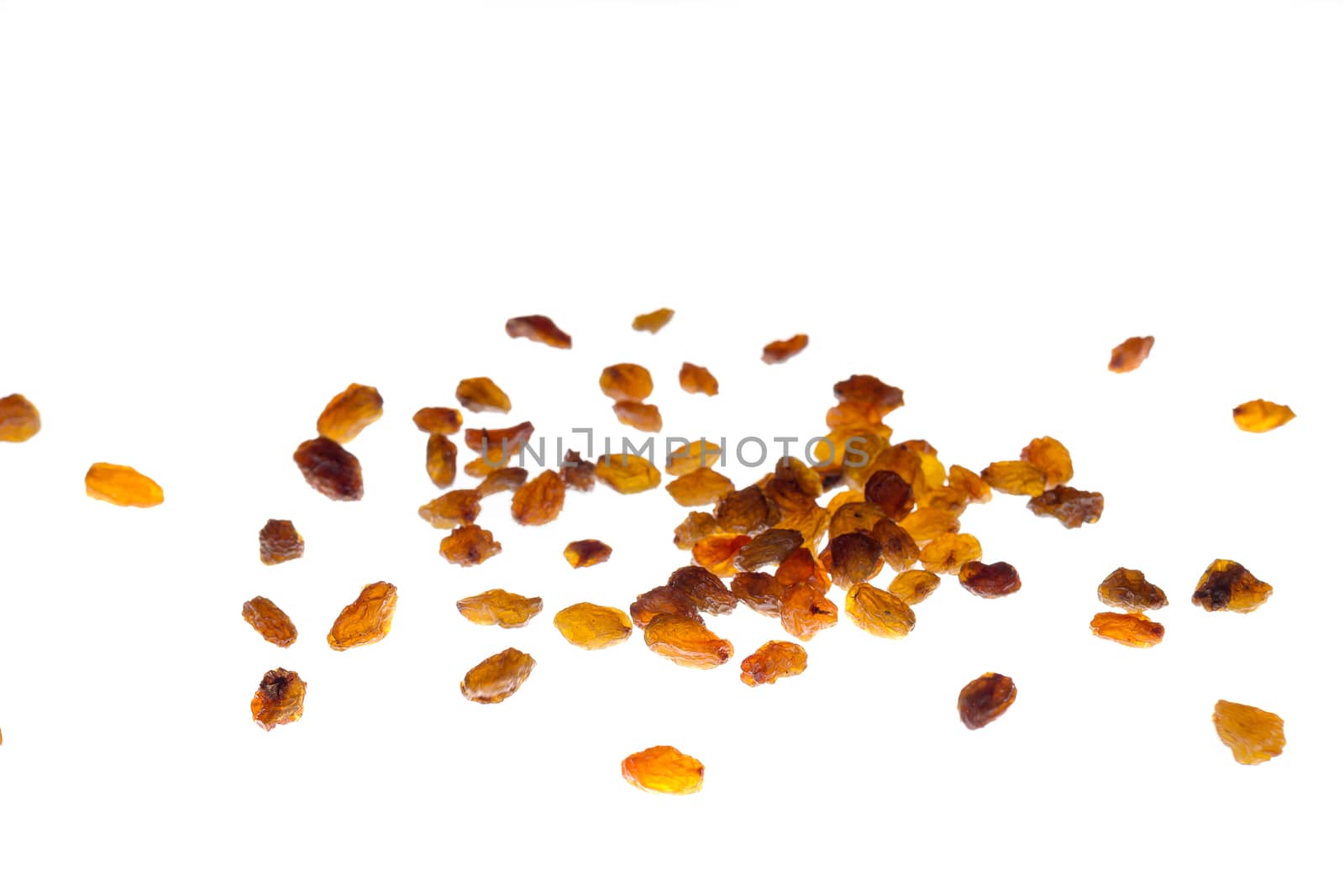 scattered raisins, isolated on white background