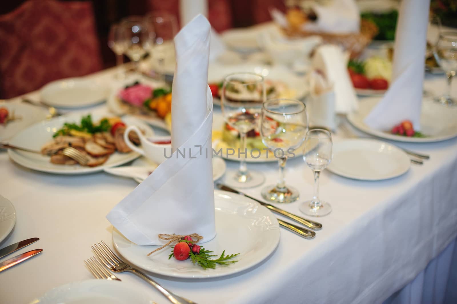 beautiful table setting for a wedding dinner in the restaurant by timonko