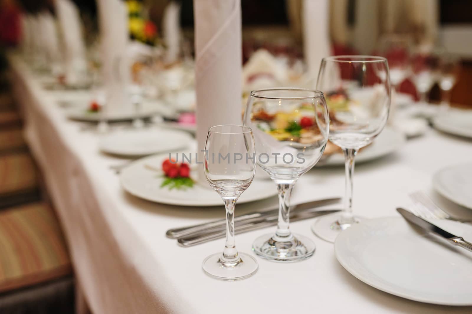 beautiful table setting for a wedding dinner in the restaurant by timonko