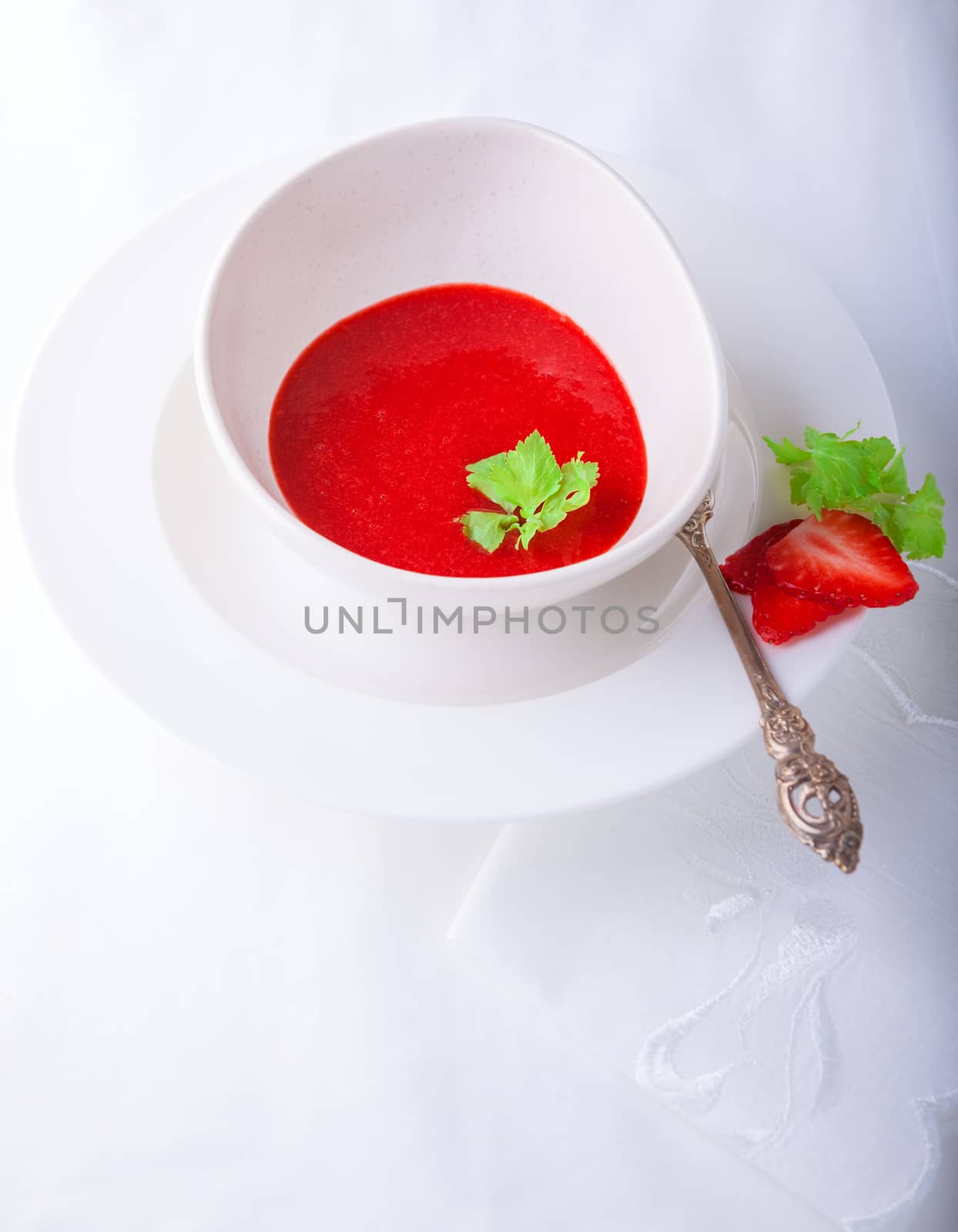 Fresh Strawberry soup with mint on white background by supercat67