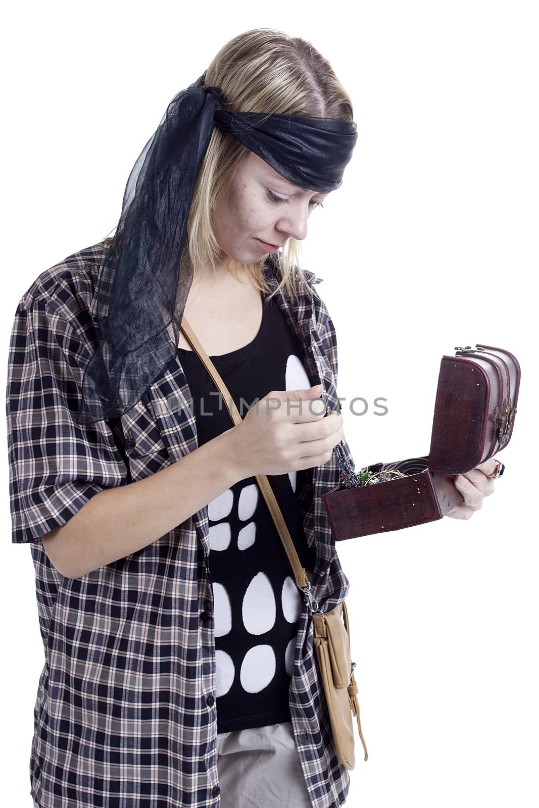 Young woman in the image of a pirate on a white background