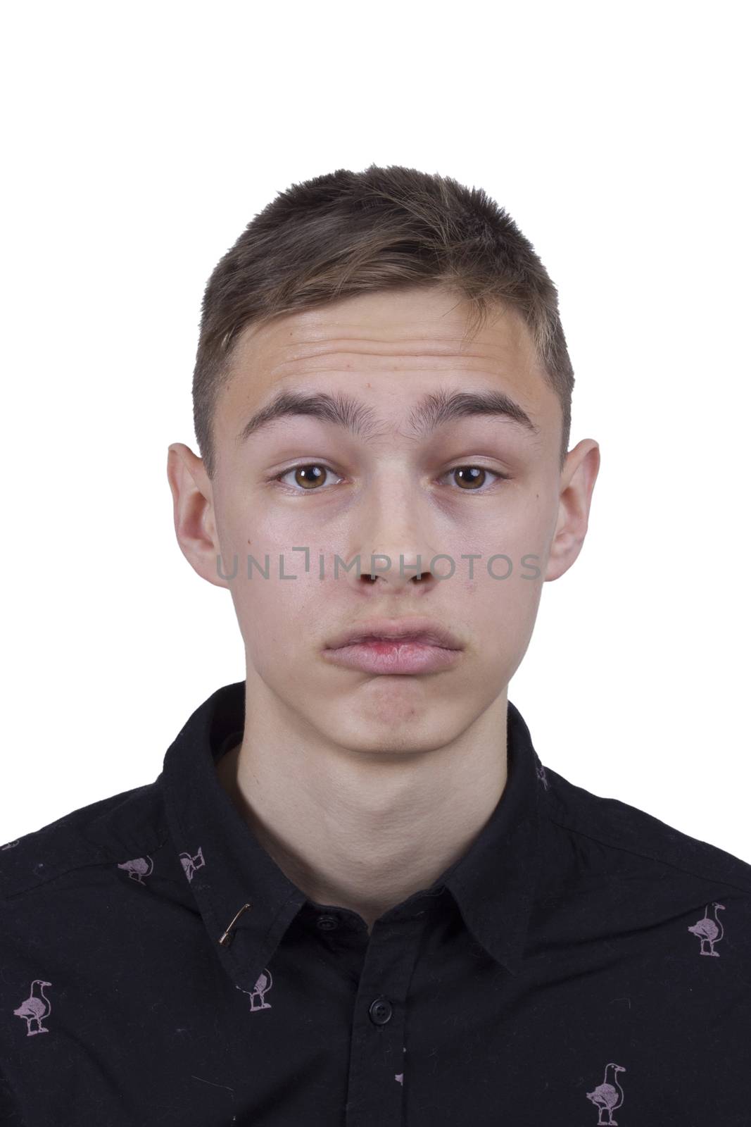 Emotional portrait of a young man on white background