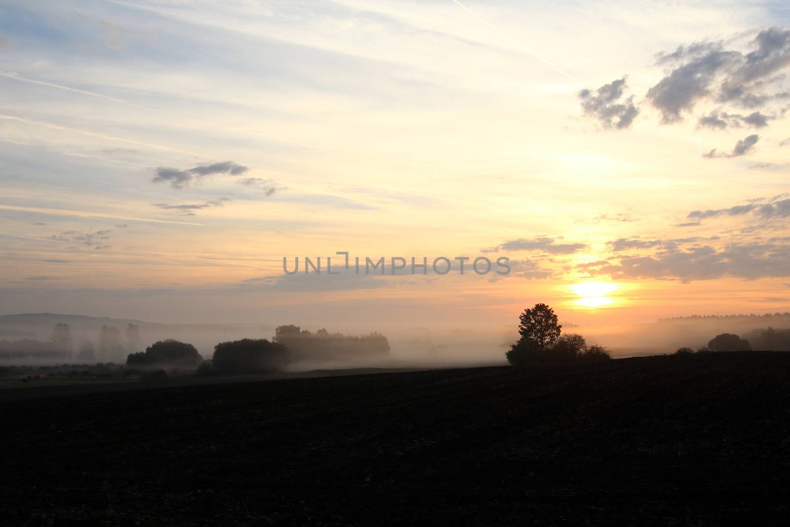 Dawn over rural countryside by Mibuch