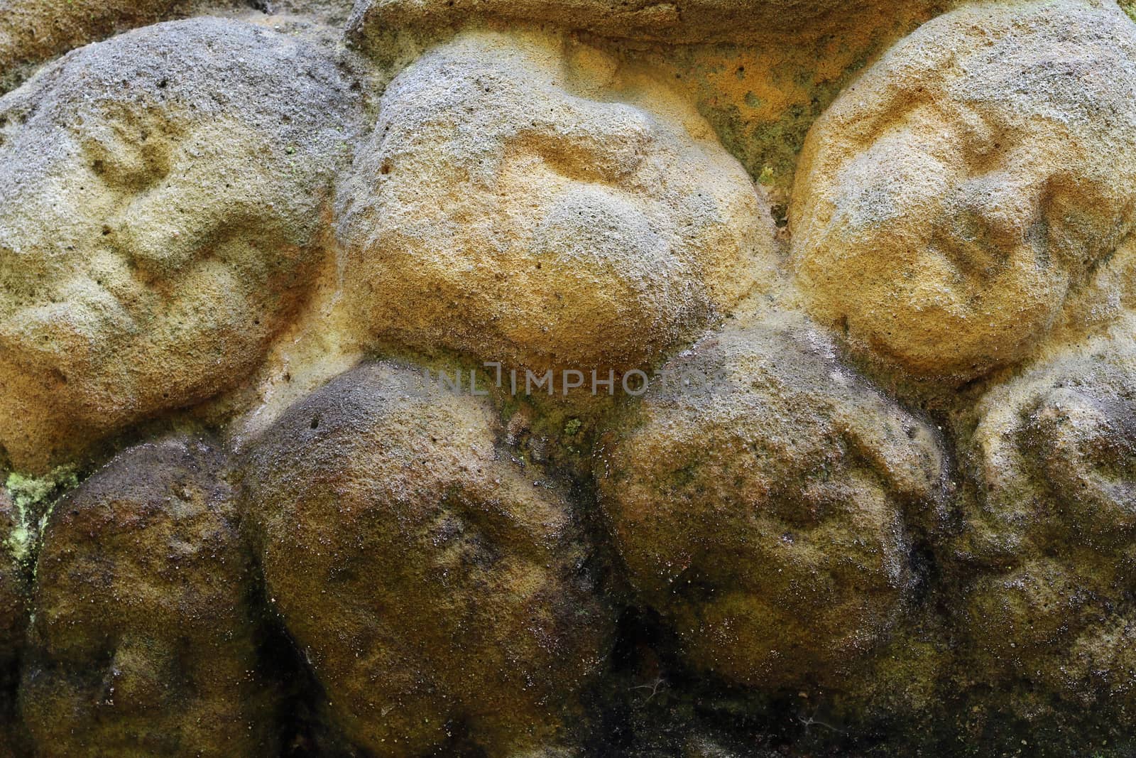 Stone altar carved into the sandstone - detail of the heads of Cherubs.
Stone altar carved in sandstone cliff in the forest near the village Marenicky, Lusatian Mountains, Czech Republic.
