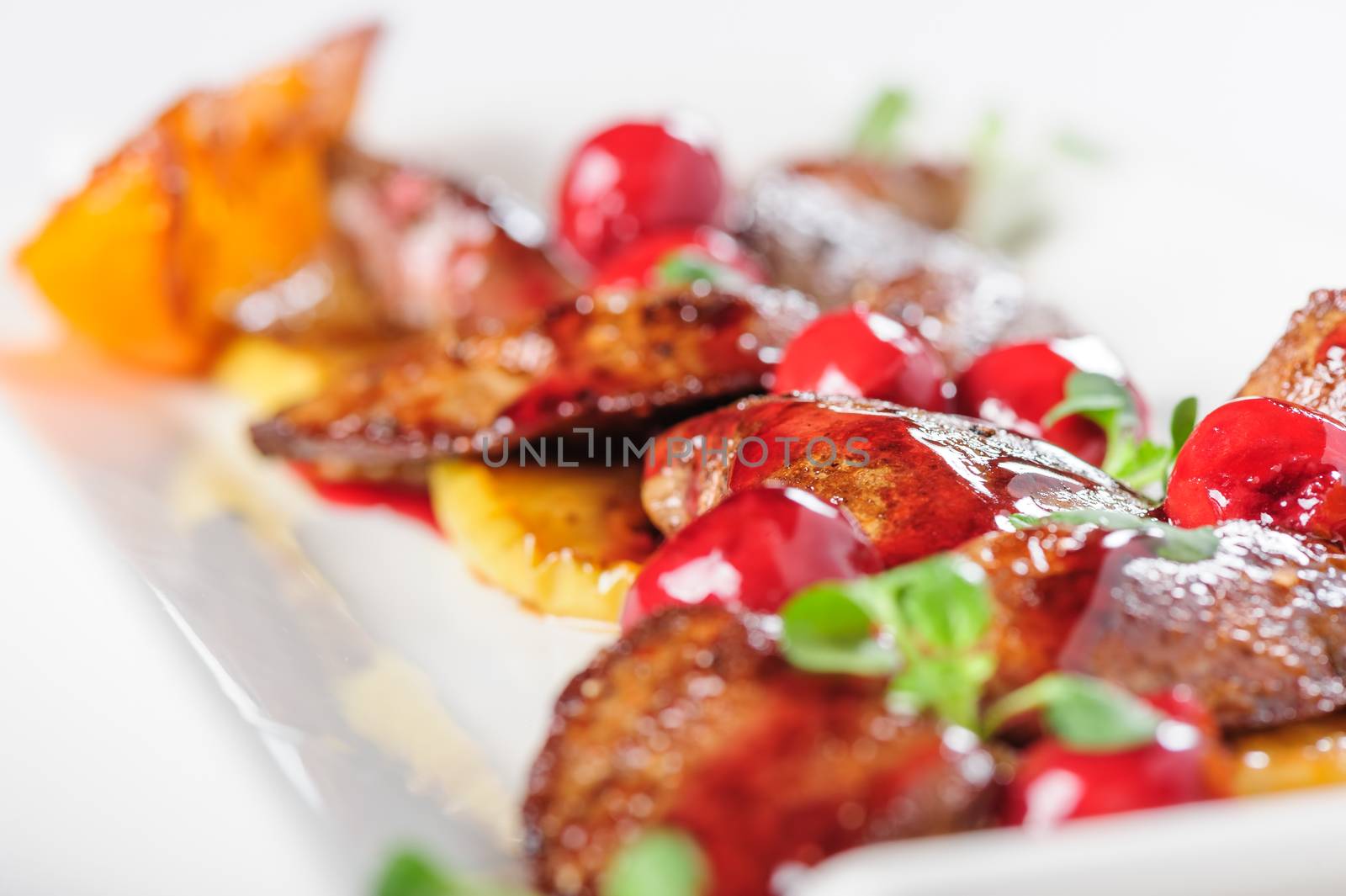 Grilled chicken's liver with chery tomato and other vegetables. Selective focus.