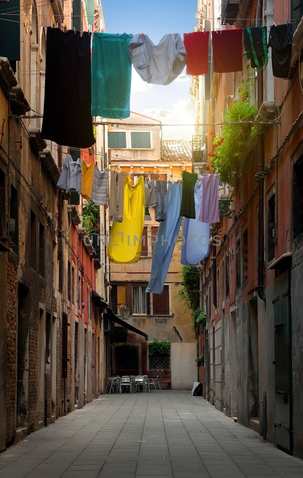 Drying clothes on venetian street at sunny day, Italy