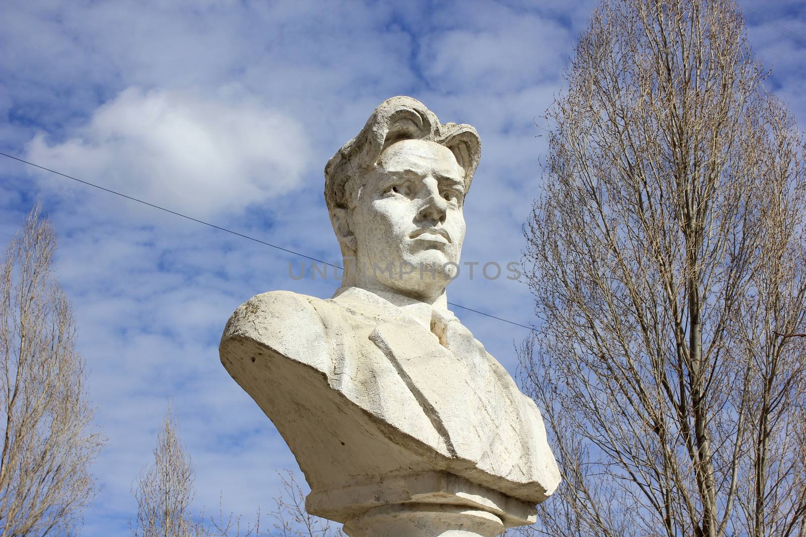 Bust of the Russian poet Mayakovsky in the yard at the building of high school in the city of Volgograd