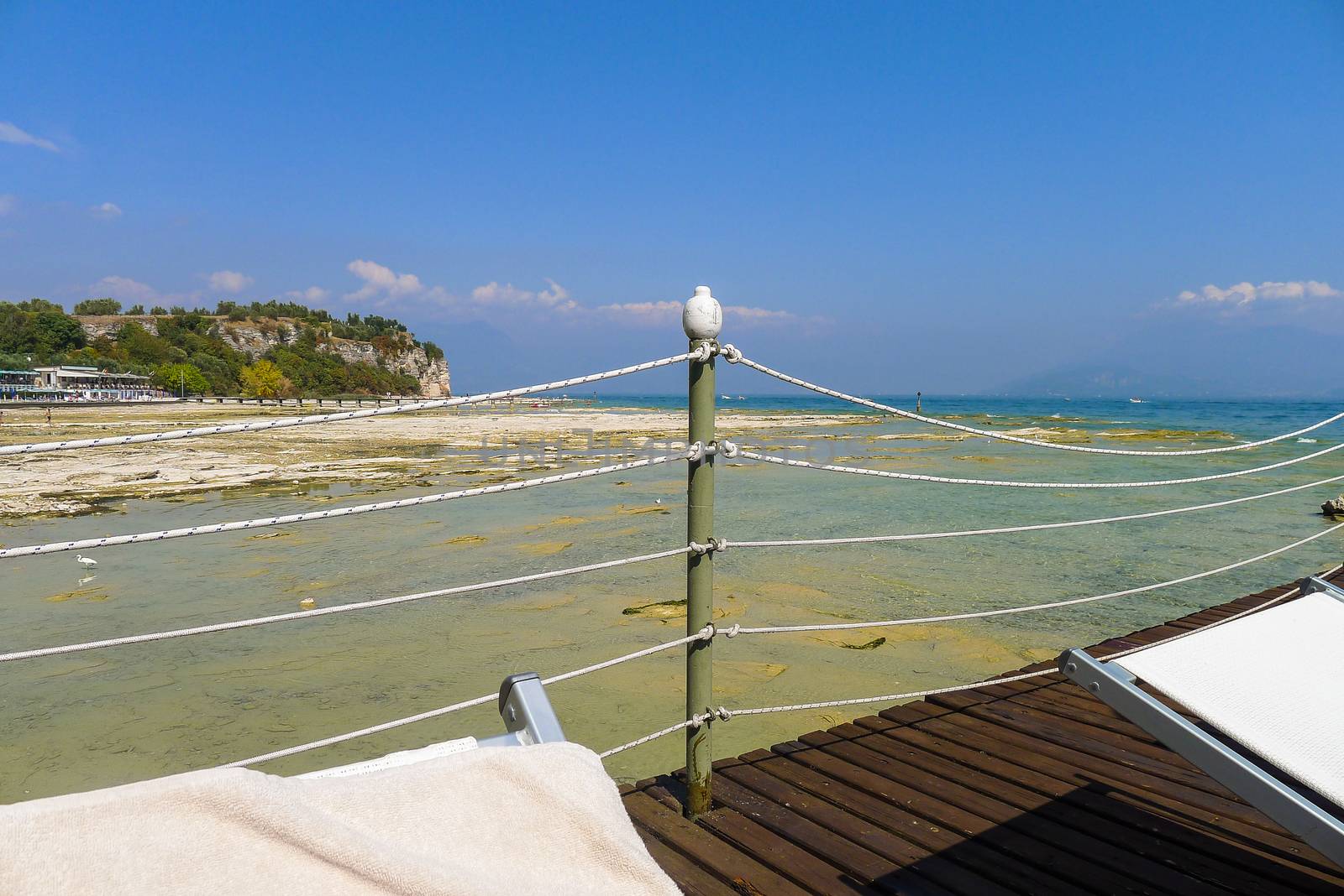 View from a sunbed in Sirmione on Lake Garda in Italy