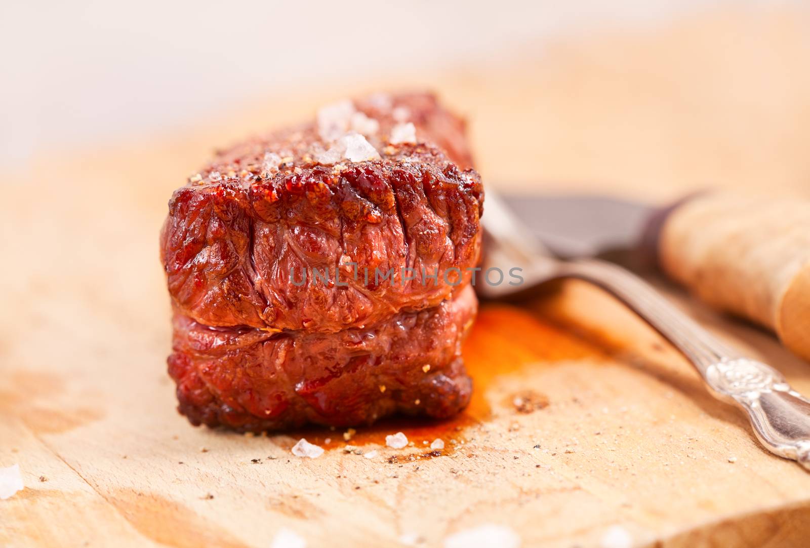 Grilled beef steak on a wooden table