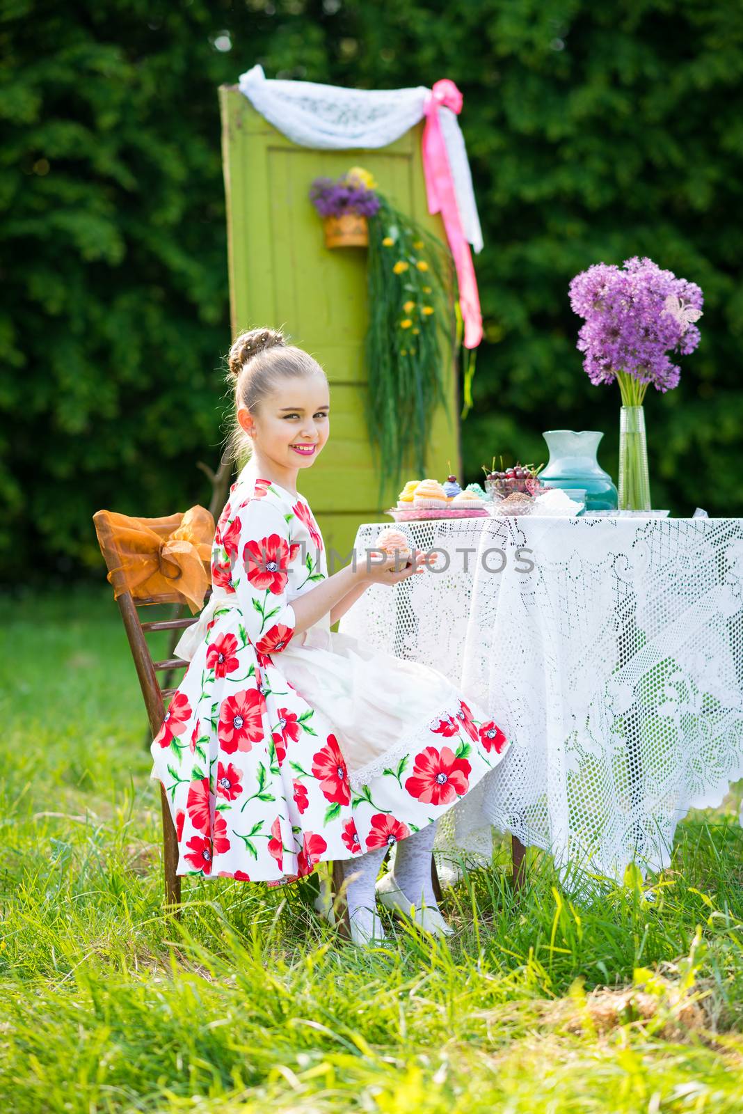 beautiful girl has breakfast in the Green Garden