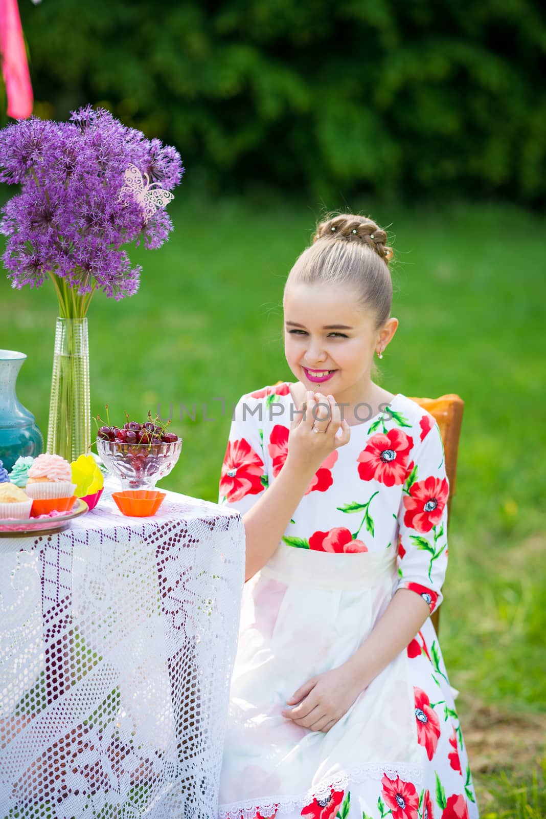 beautiful girl has breakfast in the Green Garden