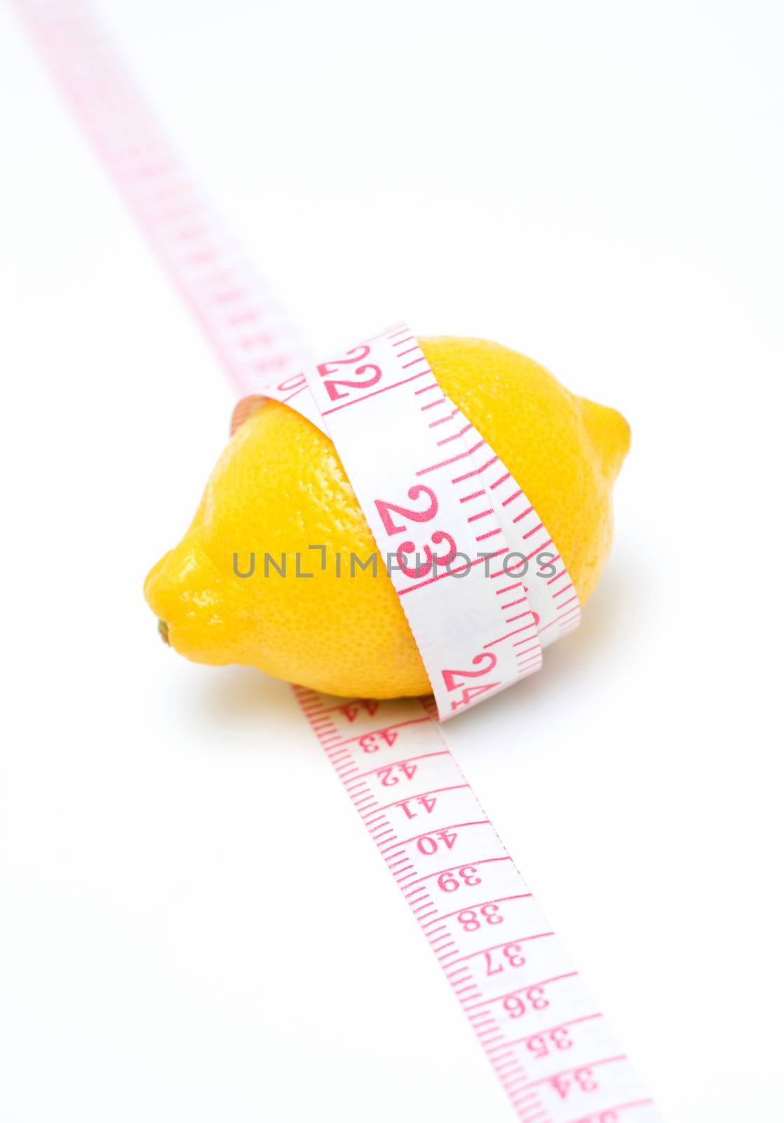 Lemon and Tape measures isolated on white background