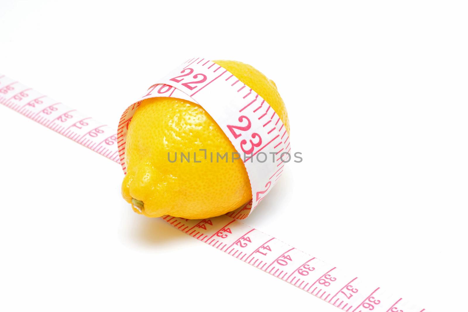 Lemon and Tape measures isolated on white background by myyaym