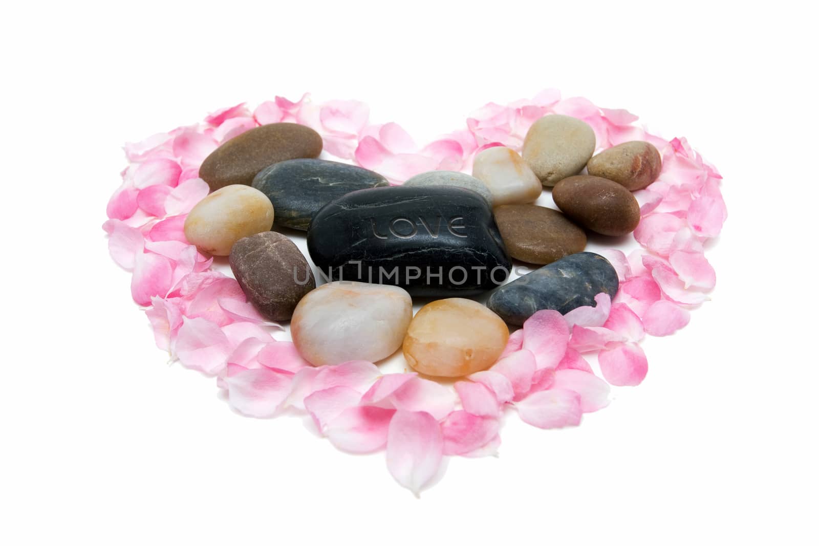 Stones and petals isolated on white background