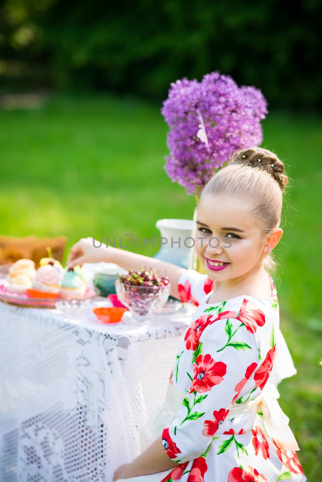 beautiful girl has breakfast in the Green Garden