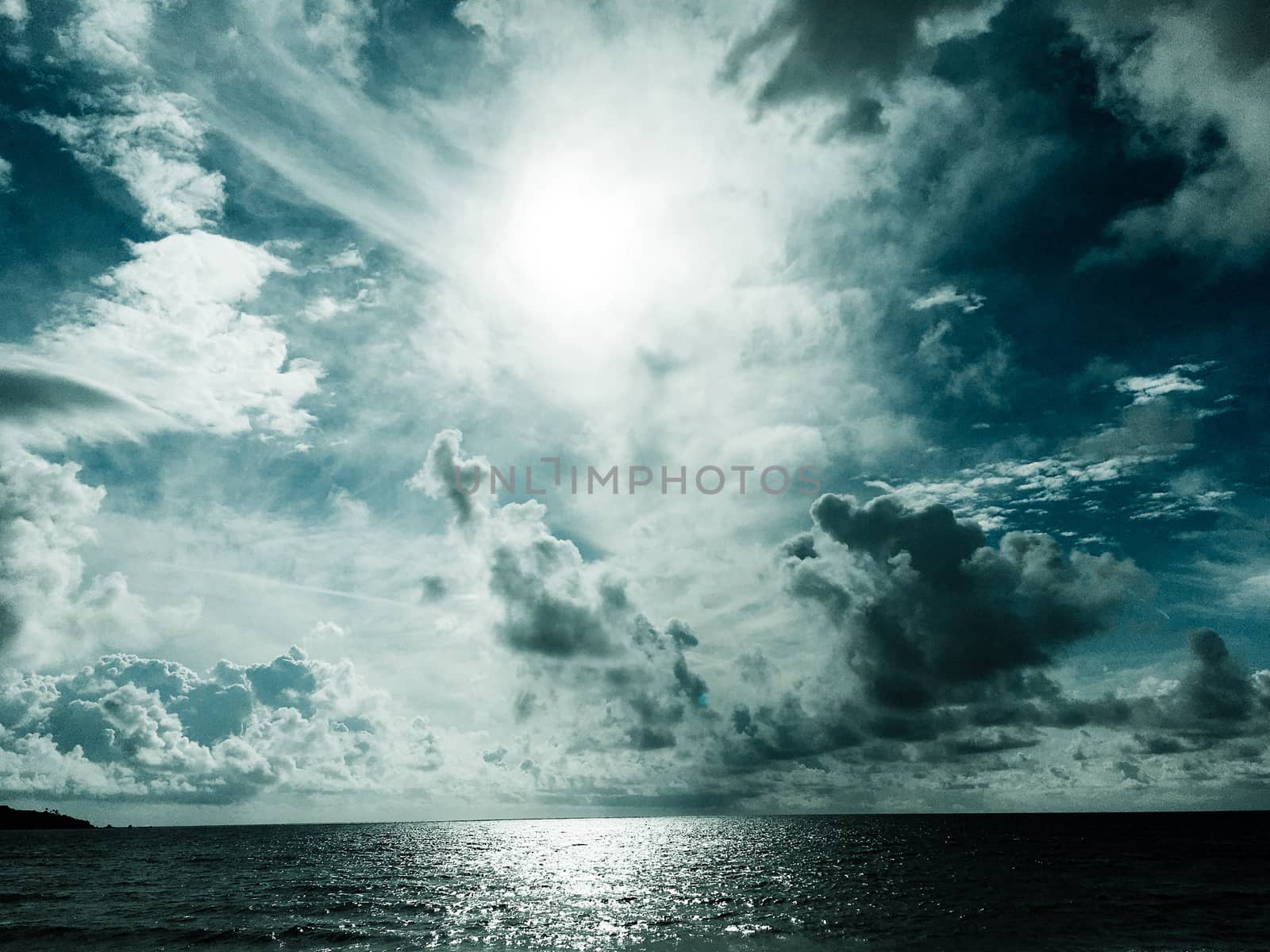 Dramatic sky with clouds background. Stormy sky and ocean. Dramatic clouds over sea.