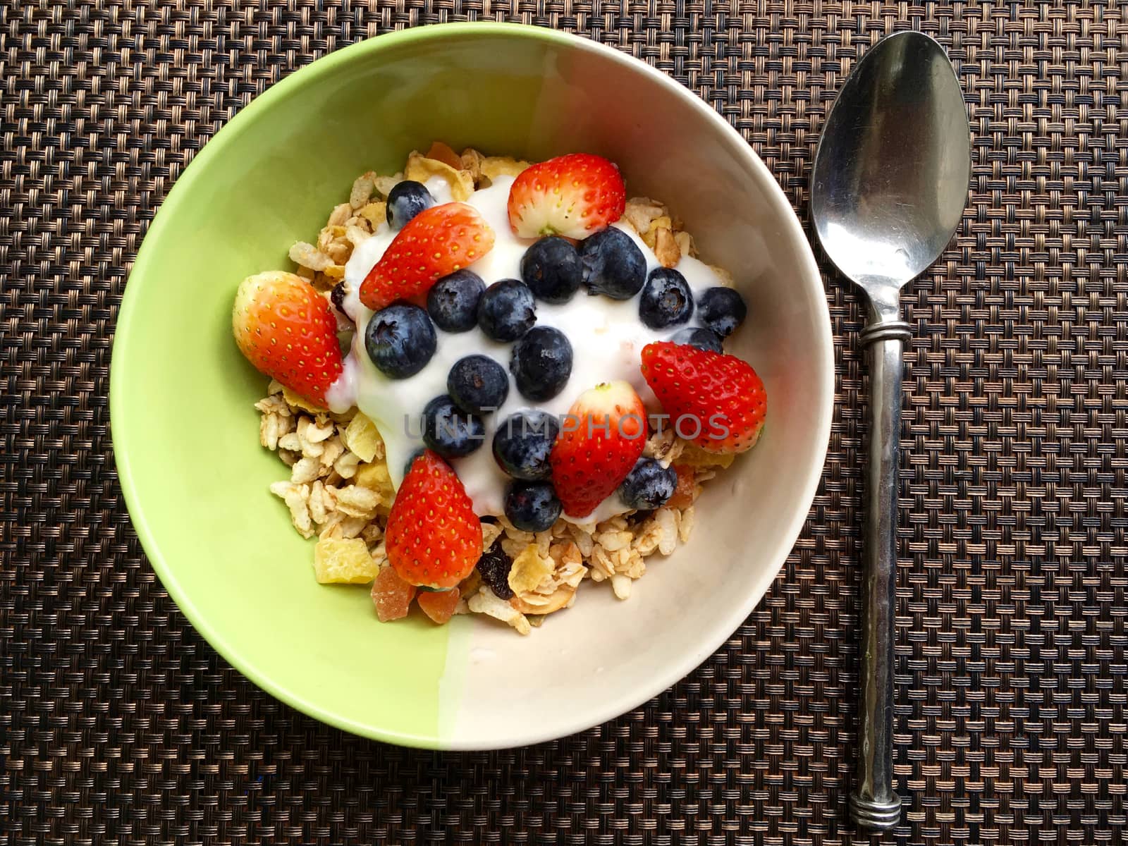 Healthy breakfast  granola with blueberries, strawberries and yogurt.